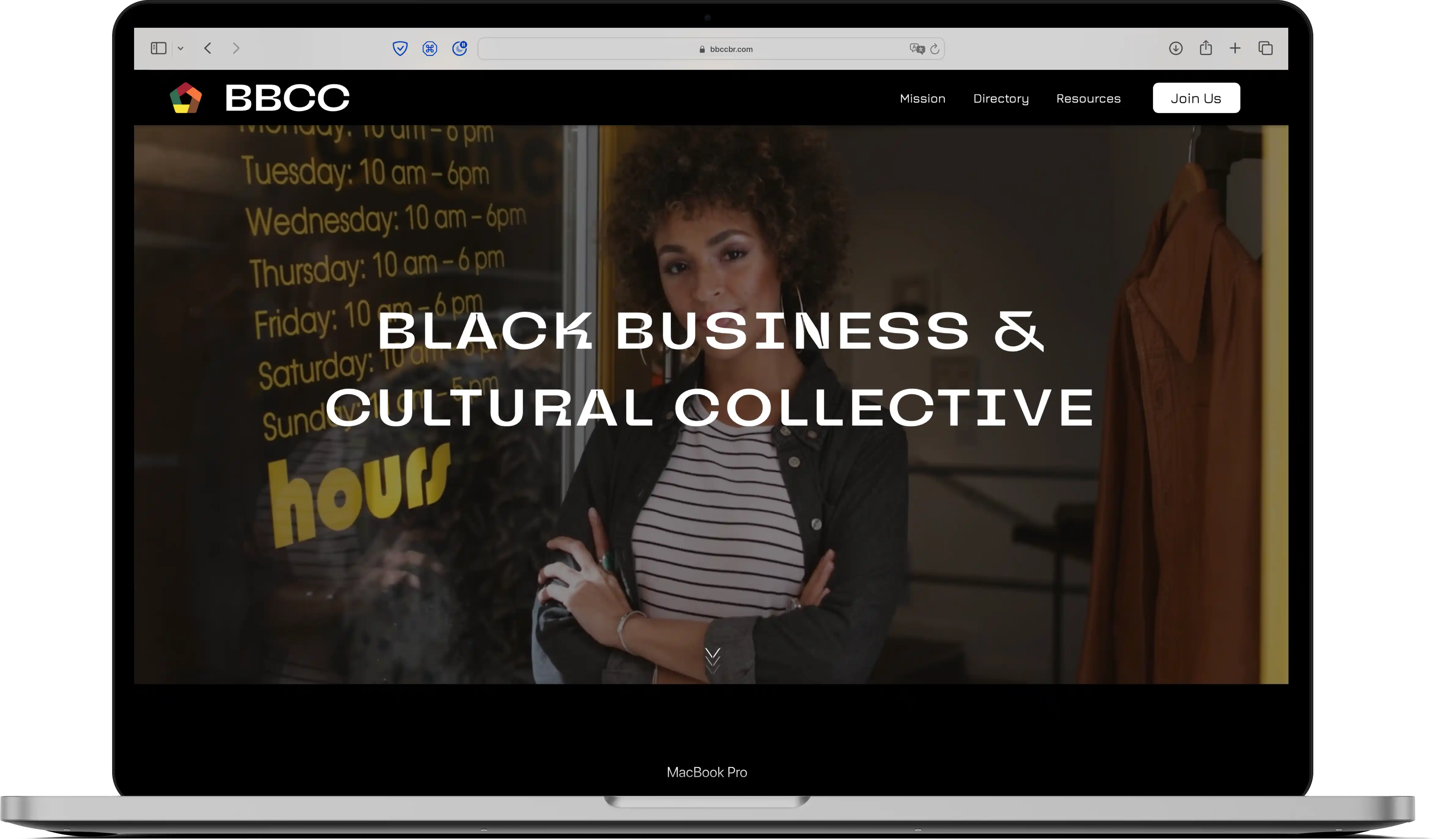 a webpage with a homepage of a black business owner woman  - mocked up on a MacBook Pro