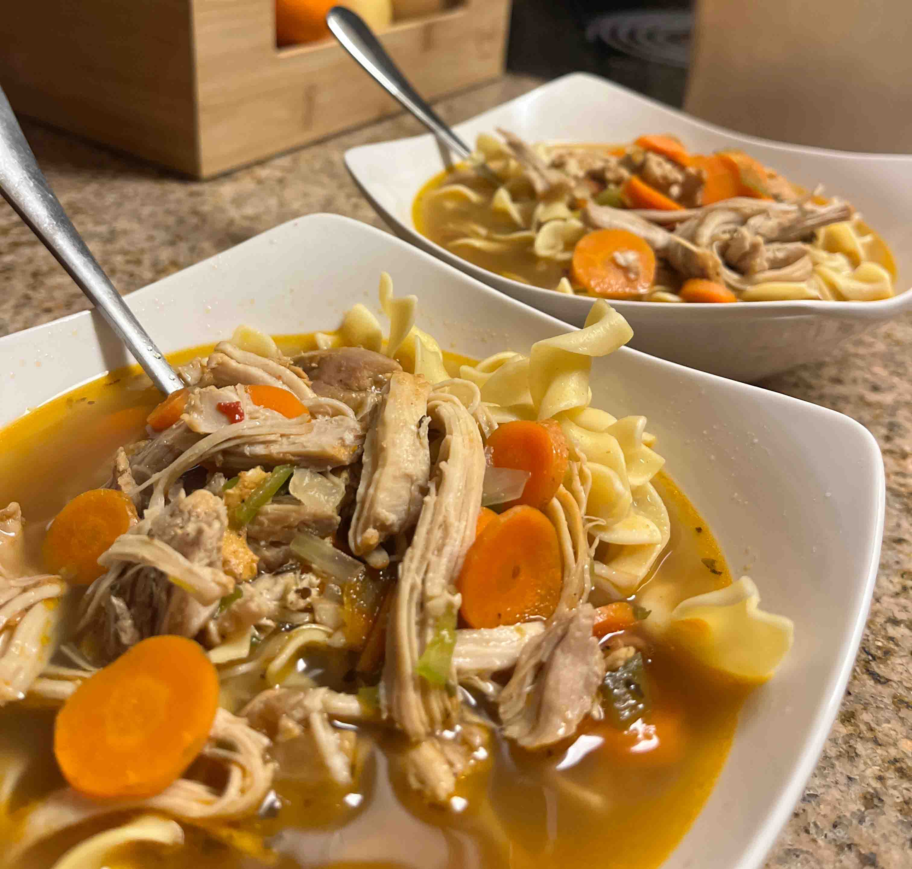 two bowls of chicken noodle soup