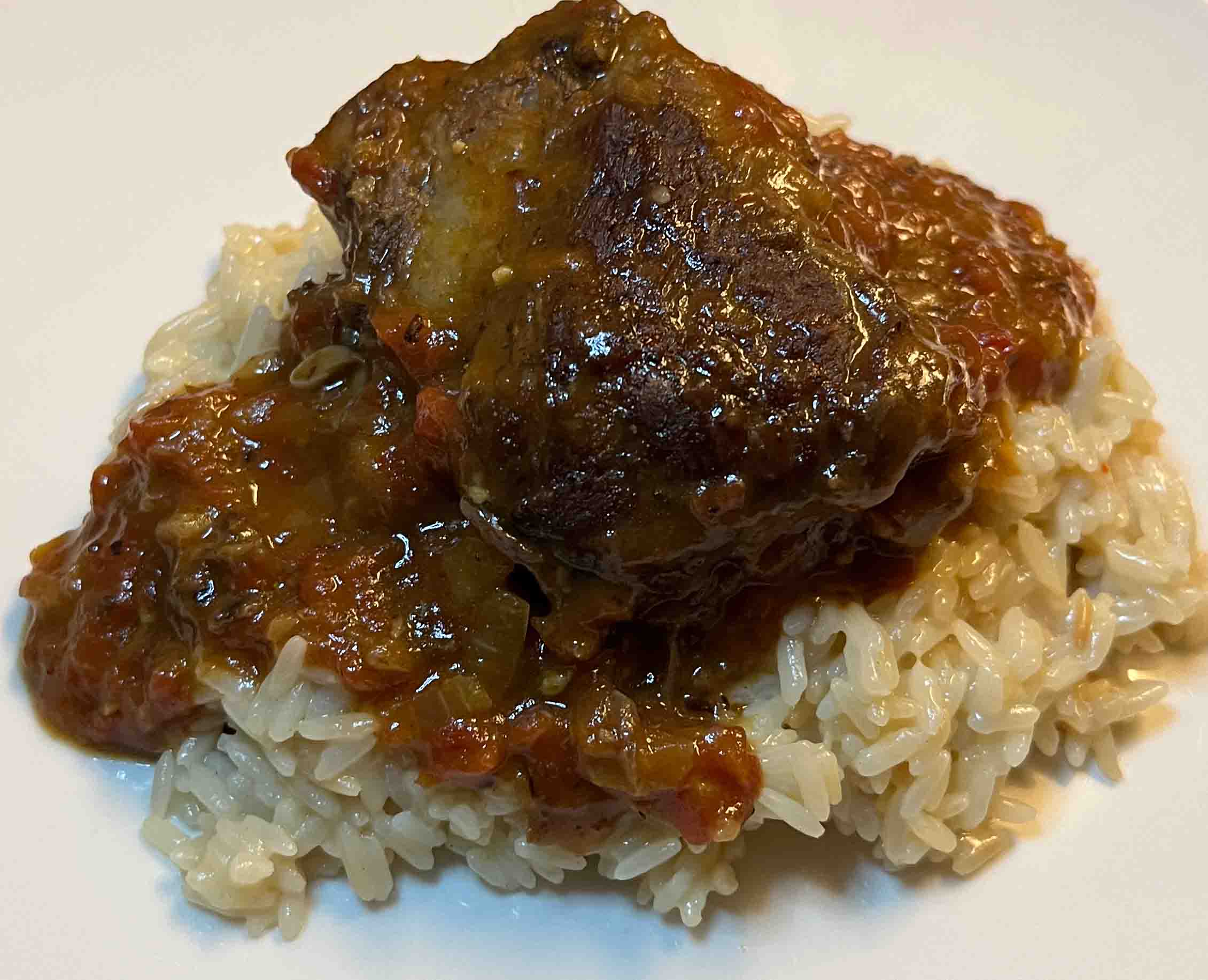 beef short rib topped with a tomato-based, etoufée-like sauce, served over risotto